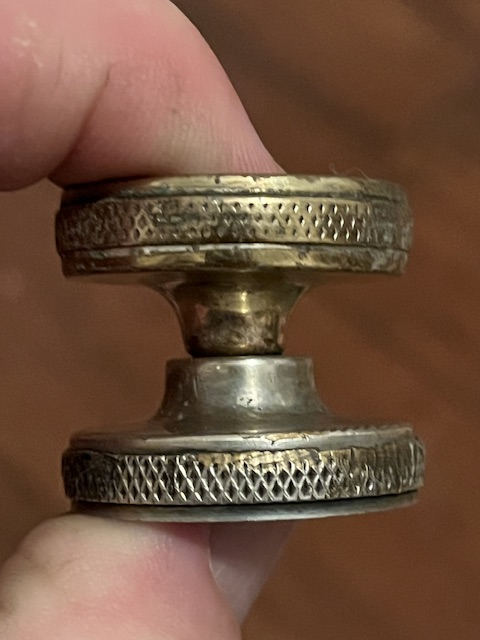 Bottom cap on top (upside down). Top cap on the bottom.